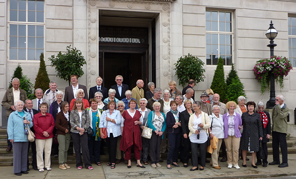 visitors pose outside Town Hall